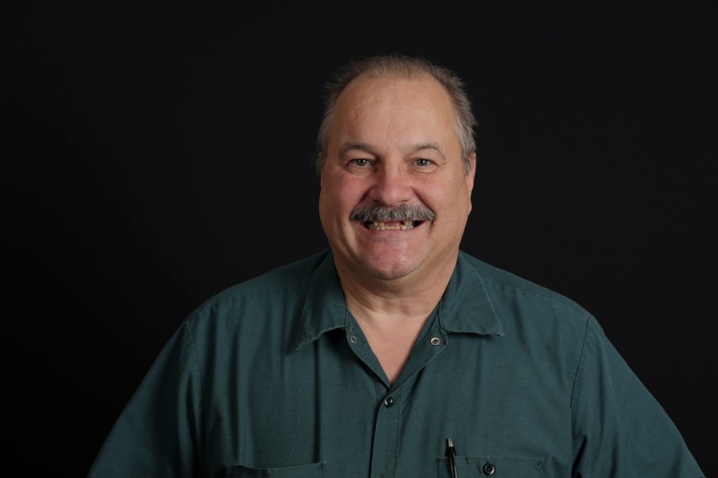 Patient two — before implant rehabilitation; discoloured, worn dentition.